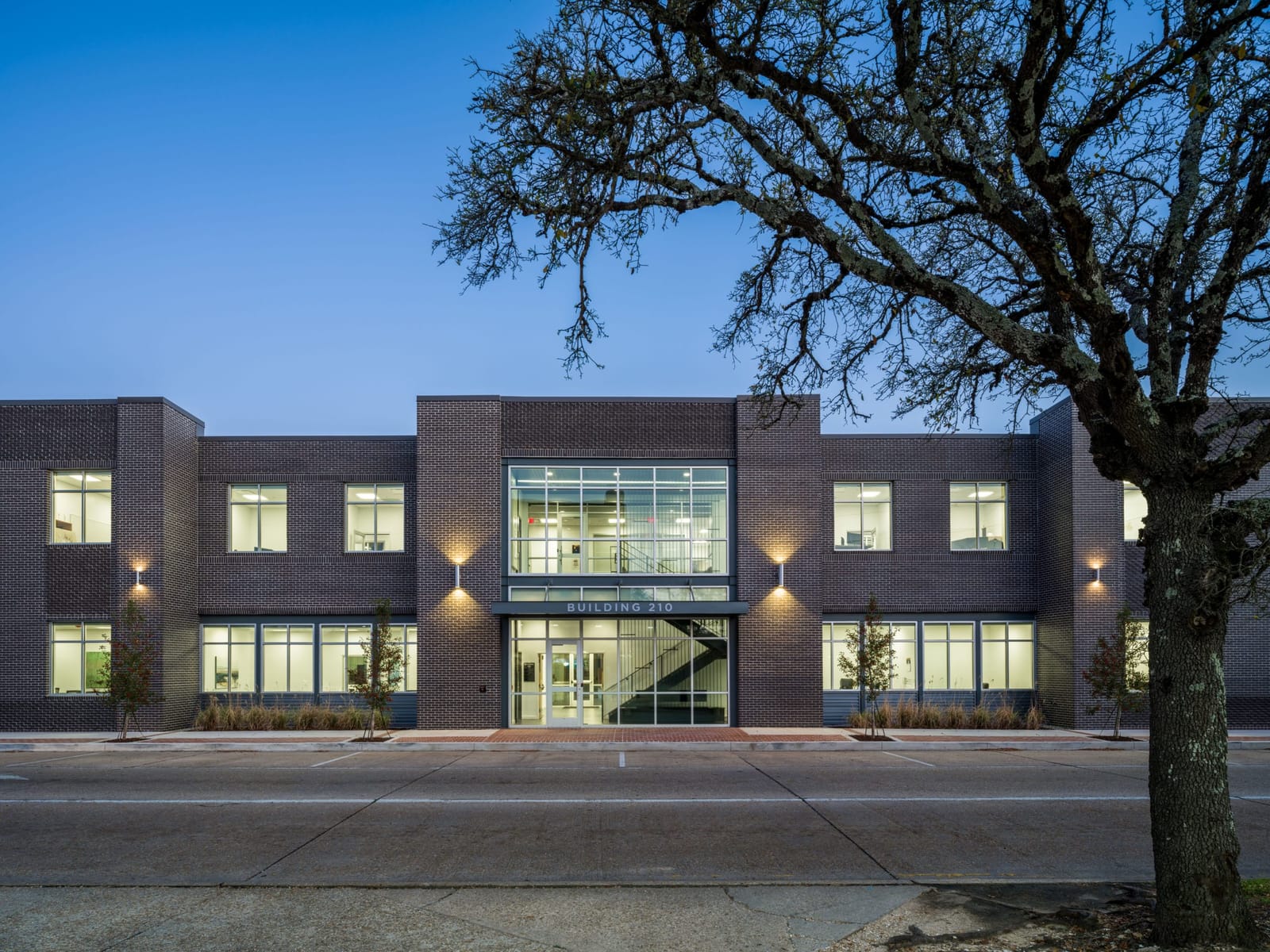 Stoa Group’s two-story corporate office building in Hammond, Louisiana at dusk